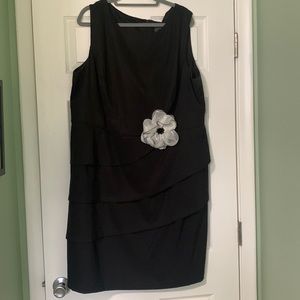 Black cocktail dress with white flower